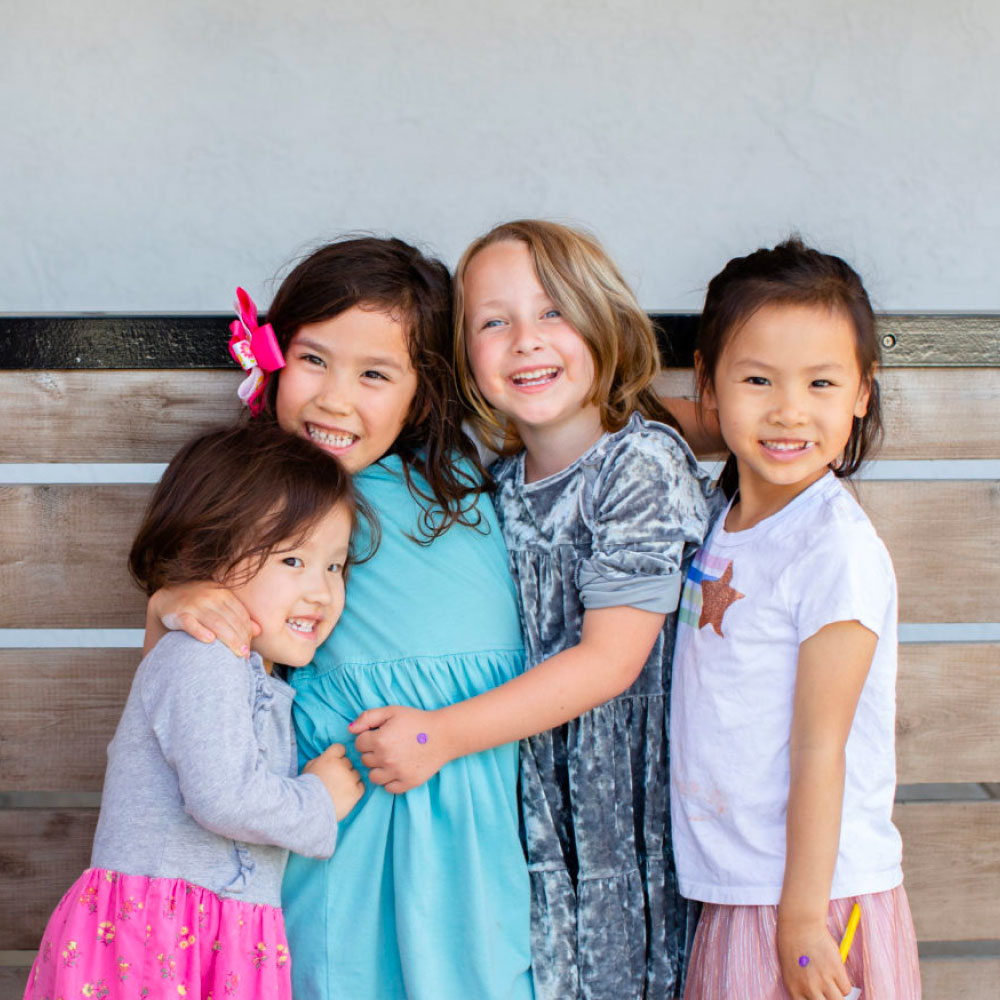 Four smiley children