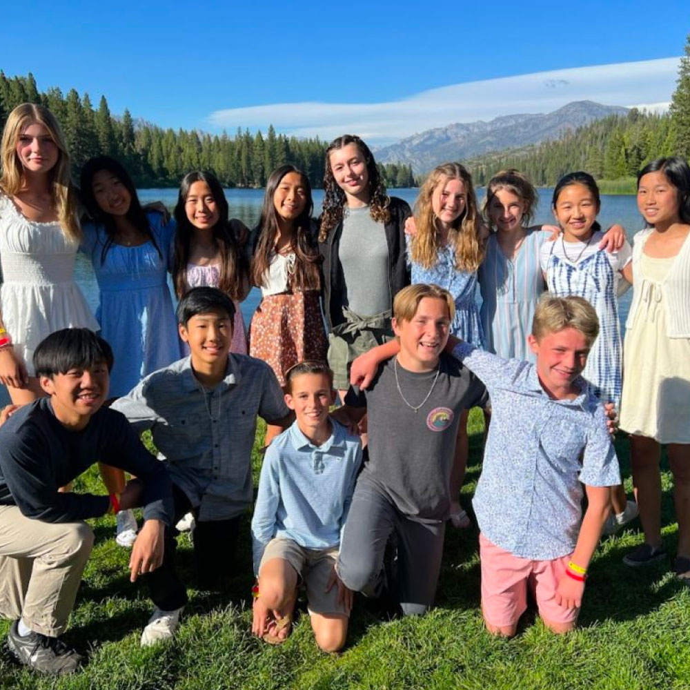 Gathering of teenage students along lake